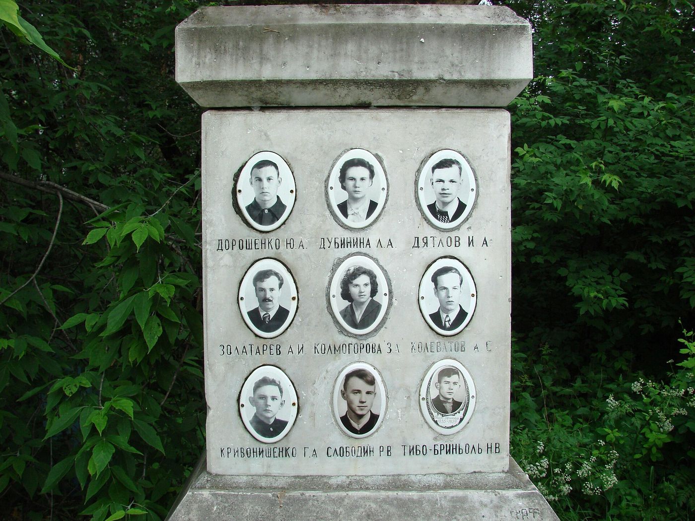 Photographs of the members of Igor Dyatlov's group on their tomb, Mikhailovskoe Cemetery, Yekaterinburg